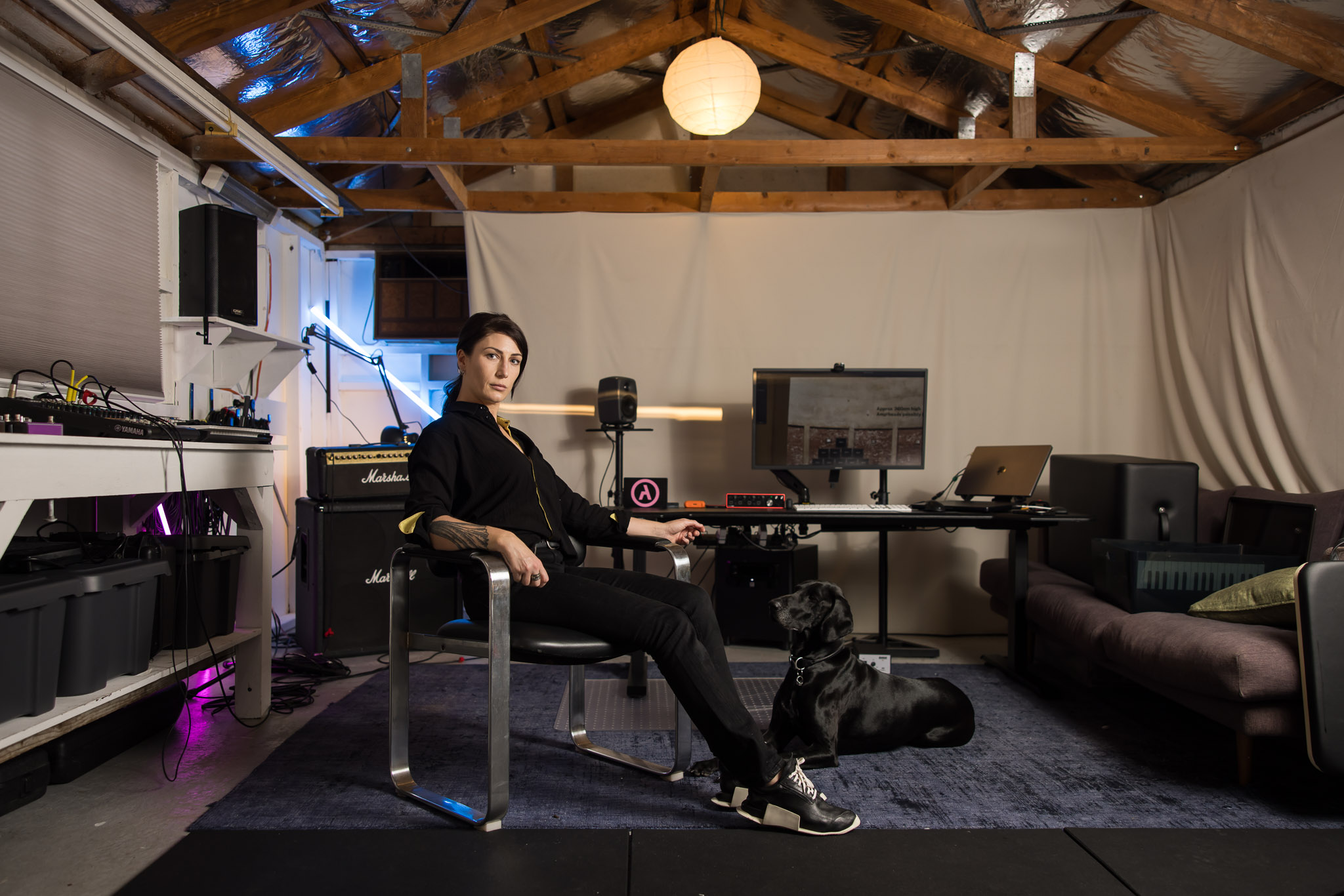 <p>Kusum Normoyle (with her best canine friend Stella) in her home studio. Photograph: Anna Kucera. </p>