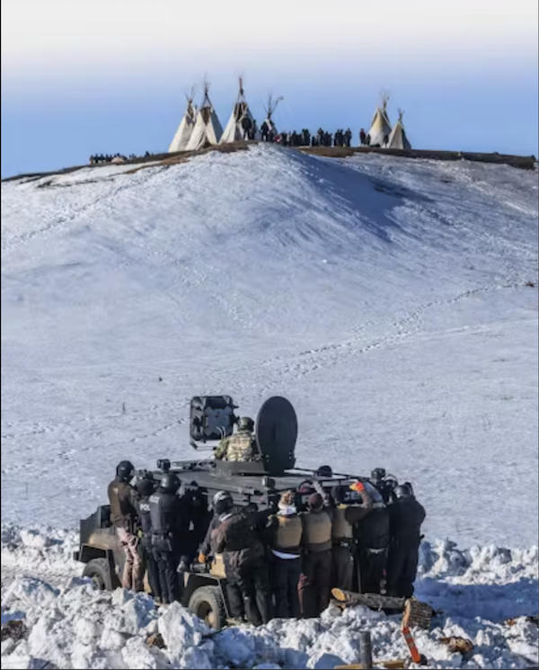 <p>An LRAD mounted on an armoured vehicle in Standing Rock. Photo: Ryan Vizzions</p>